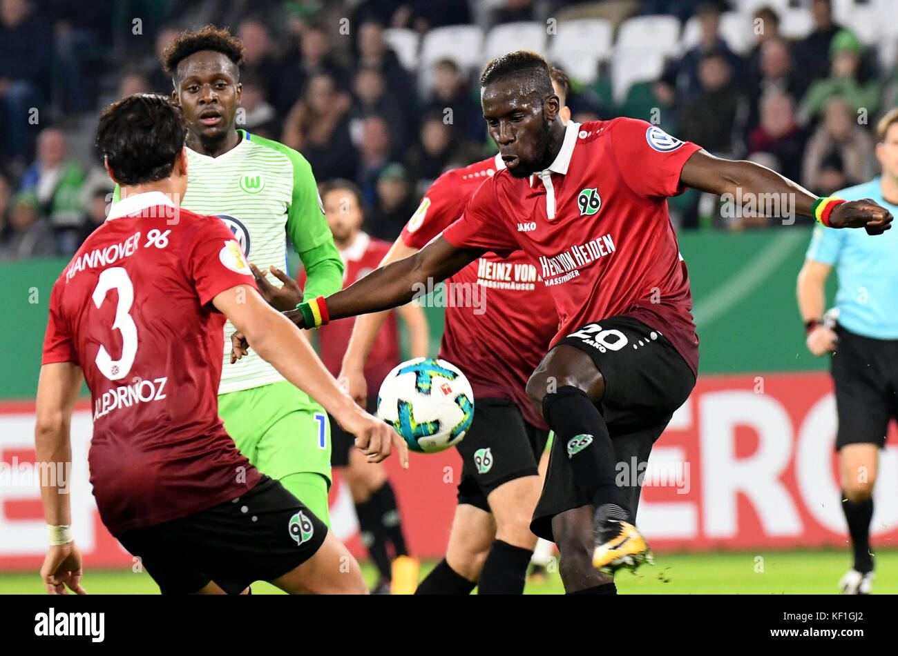 Wolfsburg's Divock Origi (2nd from left) vying for the ball against Hannover's Miiko Albornoz (L) and Salif Sane during the DFB Cup soccer match between VfL Wolfsburg and Hannover 96 in the Volkswagen Arena in Wolfsburg, Germany, 25 October 2017. (EMBARGO CONDITIONS - ATTENTION: The DFB prohibits the utilisation and publication of sequential pictures on the internet and other online media during the match (including half-time). ATTENTION: BLOCKING PERIOD! The DFB permits the further utilisation and publication of the pictures for mobile services (especially MMS) and for DVB-H and DMB only a Stock Photo