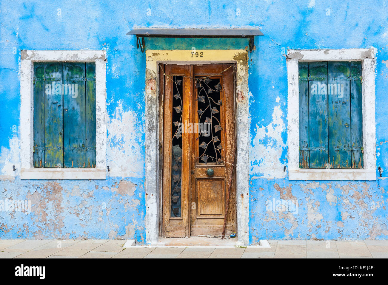 VENICE ITALY VENICE Fishermans house Shabby blue painted house with wooden door and blue shutters Island of Burano Venice Lagoon Venice Italy Europe Stock Photo