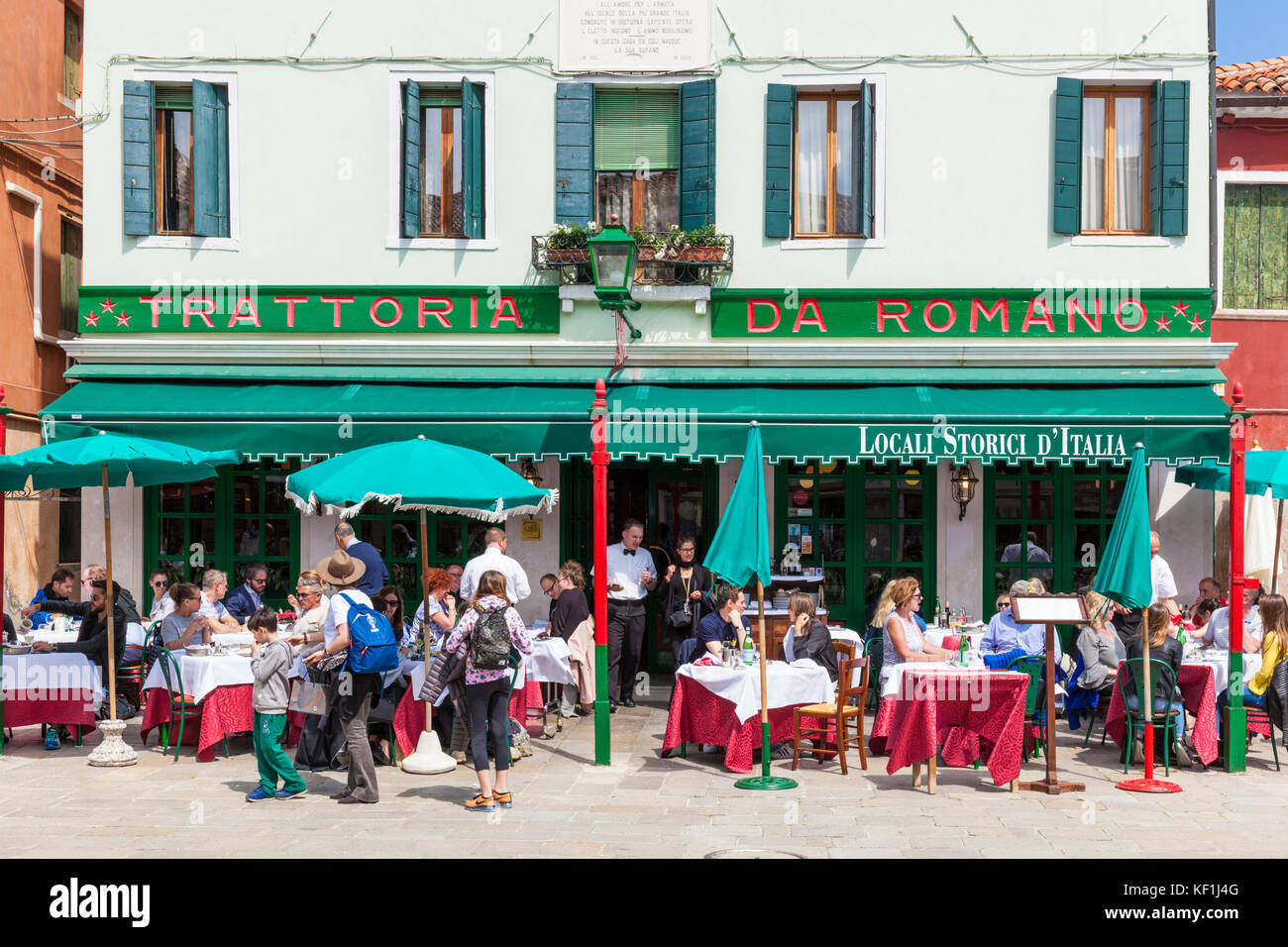 VENICE ITALY VENICE People eating at a typical family owned Trattoria da Romano on the venetian island of Burano venice Lagoon Venice Italy EU Europe Stock Photo