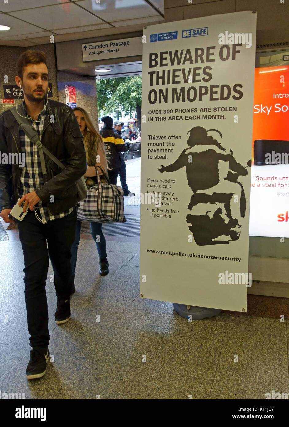 Police poster in Tube station warning about moped riding thieves