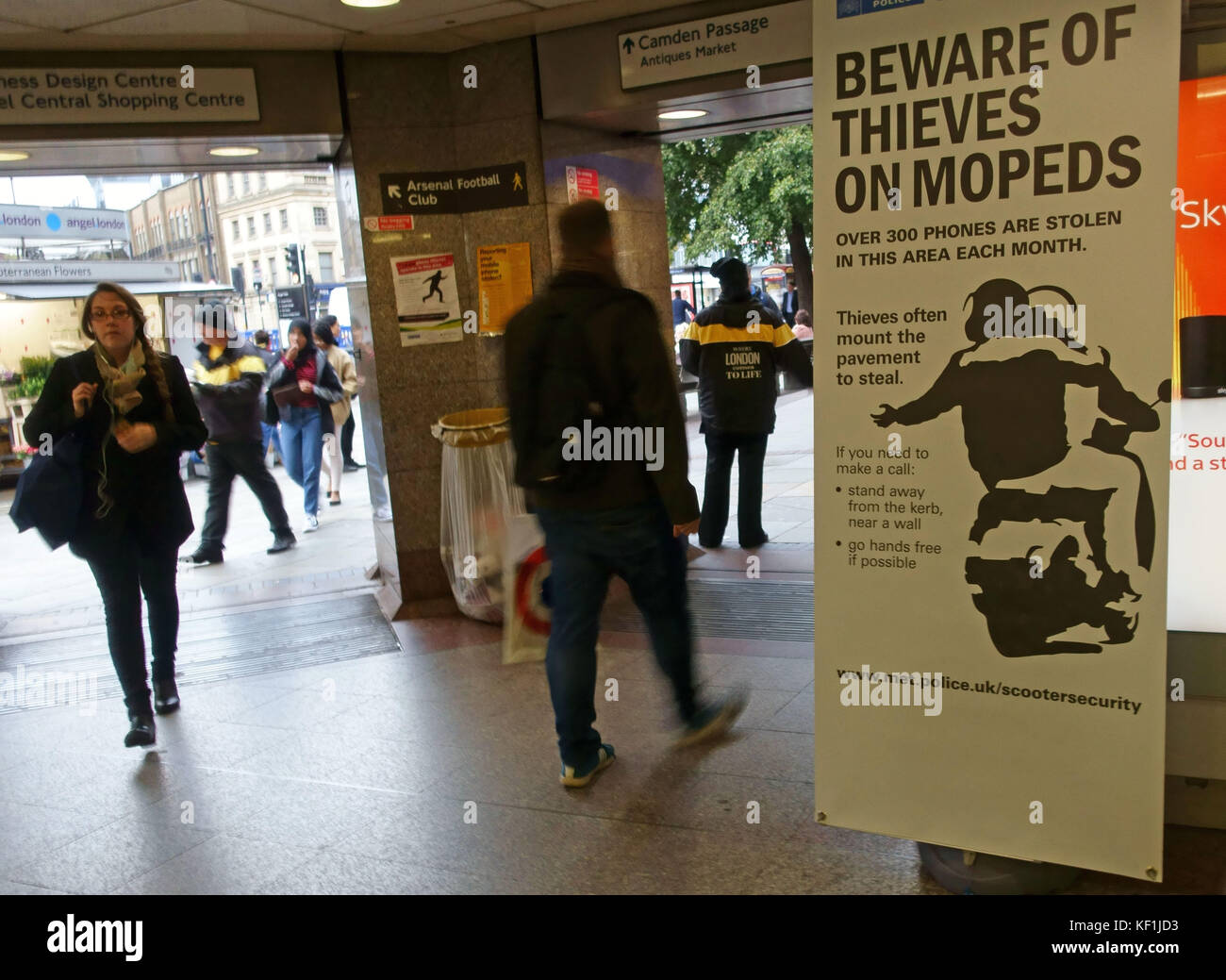 Police poster in Tube station warning about moped riding thieves