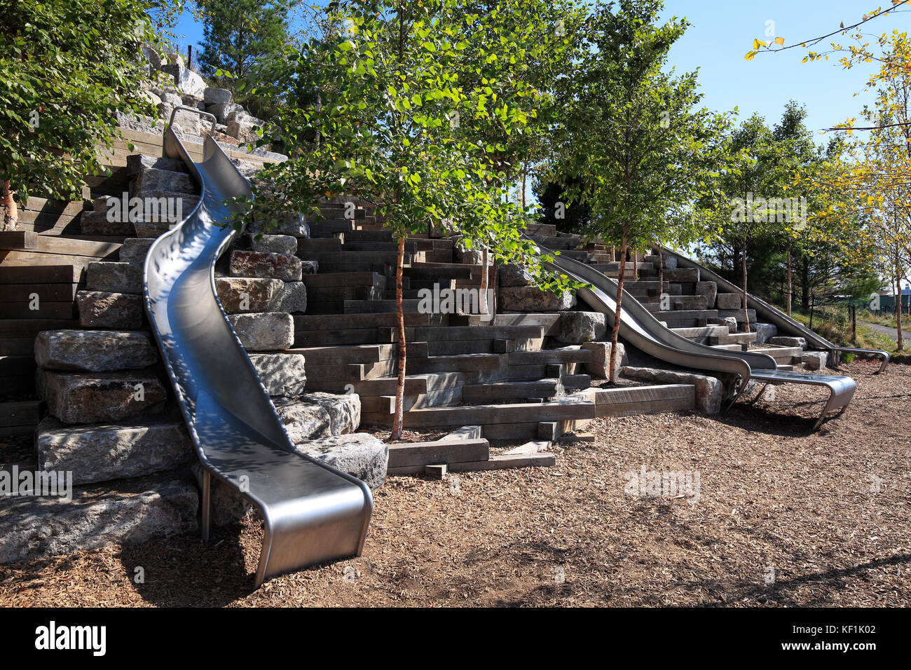 Playground with long slides at The Hills Park on Governors Island Stock