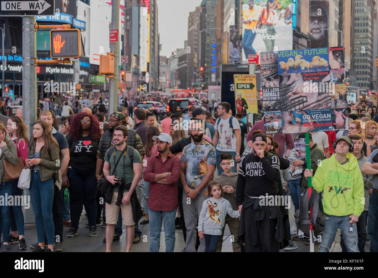 Many multicultural background people of all races in New York City Times Square with humorous facial expressions Stock Photo