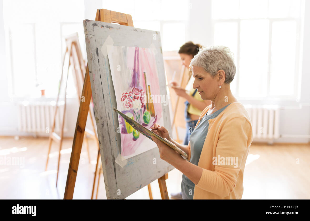 woman artist with easel painting at art school Stock Photo - Alamy