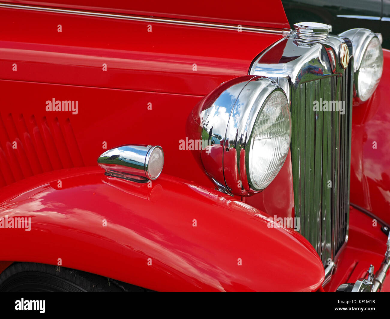 detail of classic car showing chrome sidelight,headlight and radiator