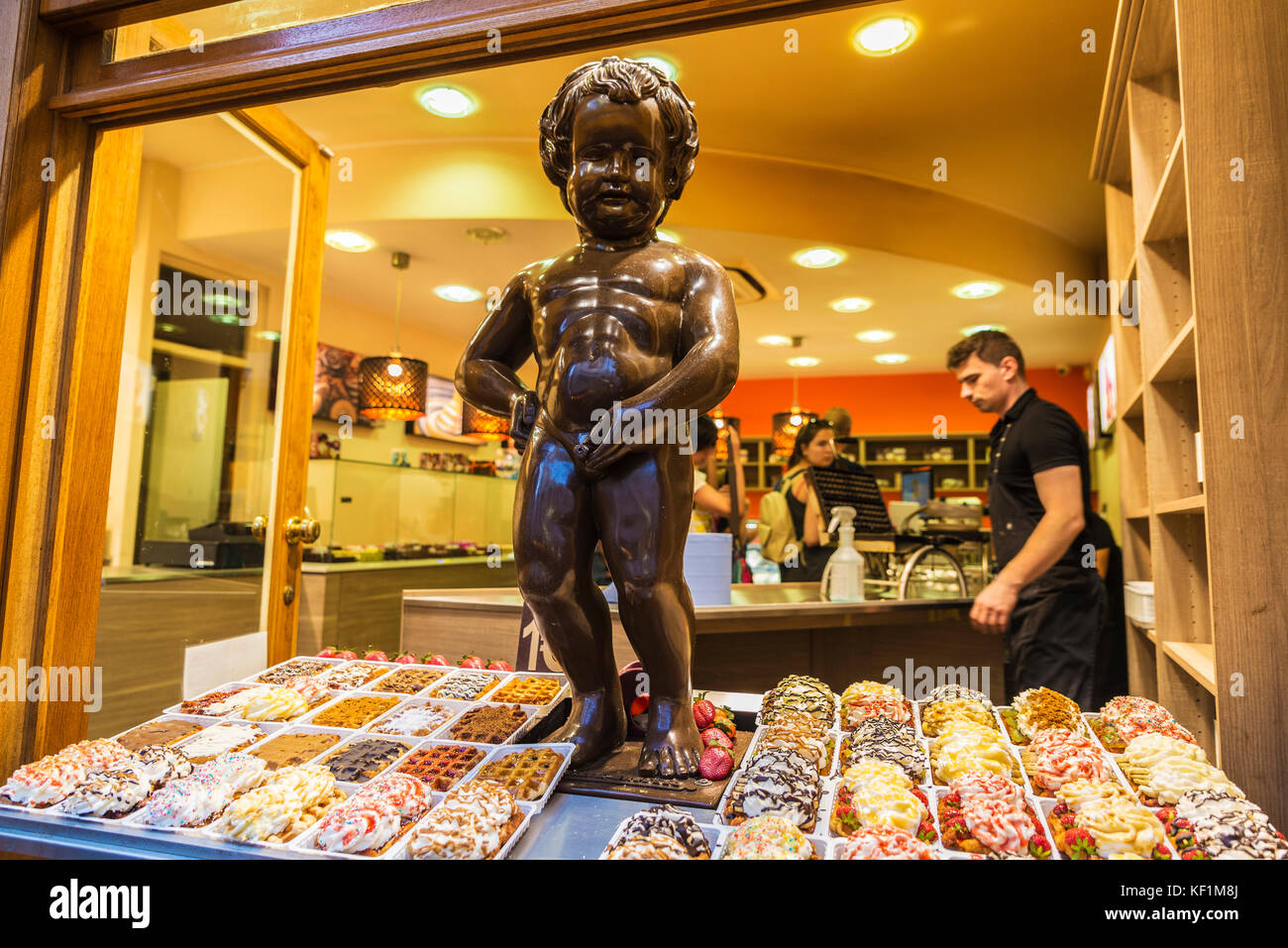 Brussels, Belgium - August 26, 2017: Statue of chocolate of Manneken pis as a candy store decoration with people located in the historical center of B Stock Photo