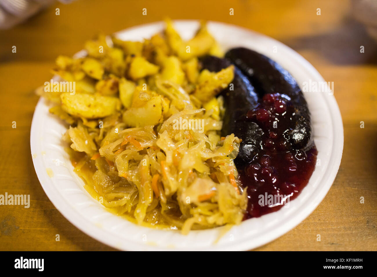 braised cabbage and sausages with sauce on plate Stock Photo Alamy