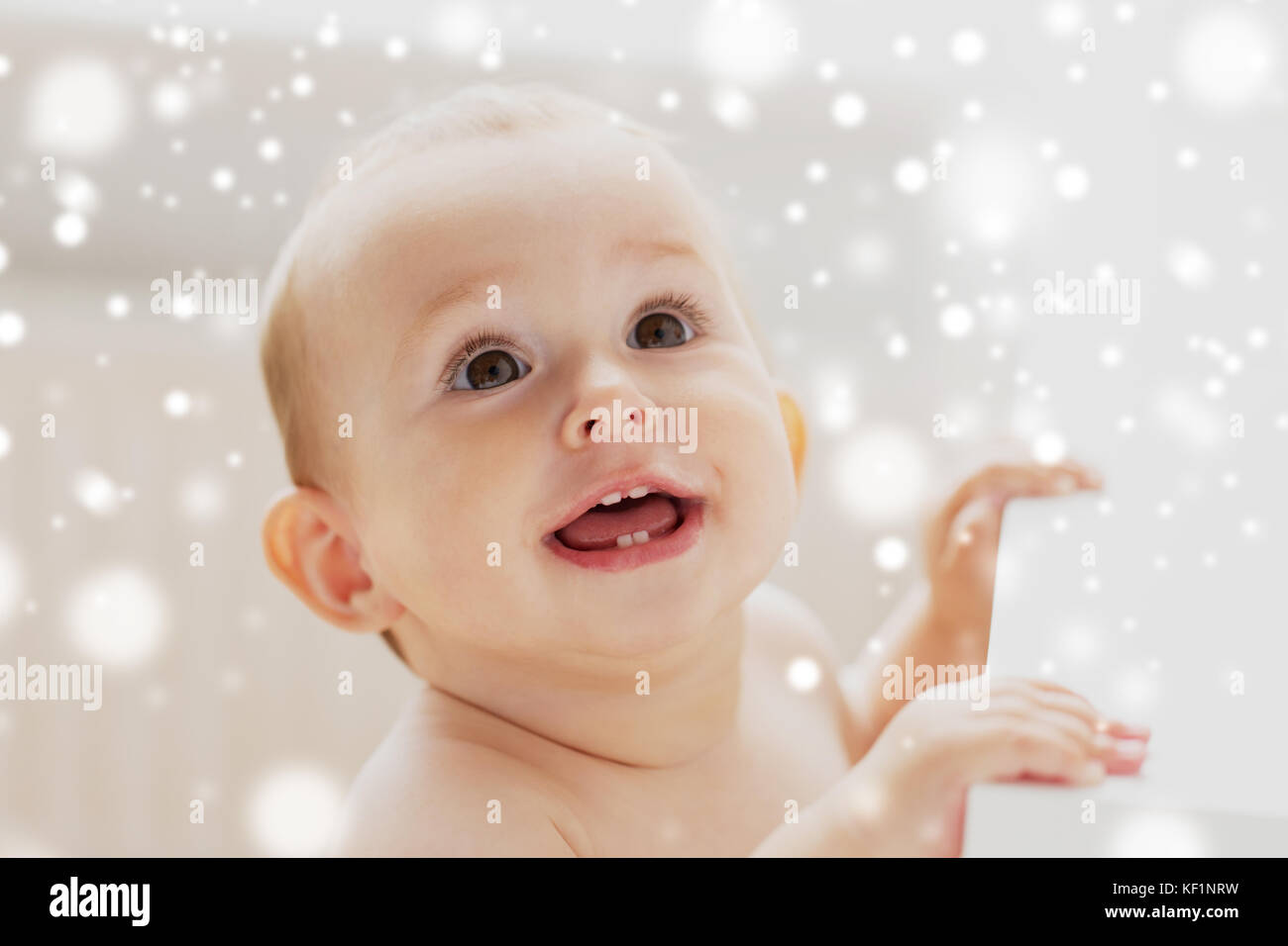 face of happy little baby boy or girl looking up Stock Photo - Alamy