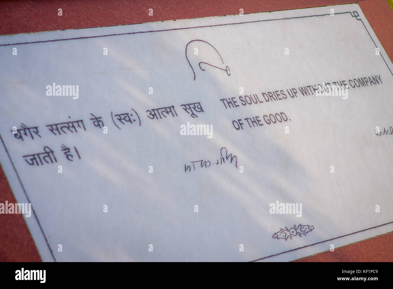 DELHI, INDIA - SEPTEMBER 25 2017: Informative sign written over a grave wih a beautiful words in Rajghat New Delhi, memorial in Delhi, India Stock Photo