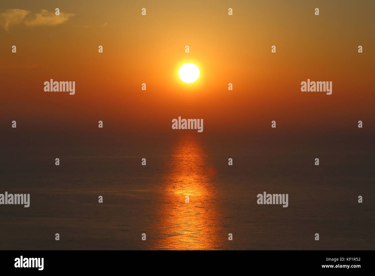 Golden sunset with reflection on the sea Stock Photo - Alamy