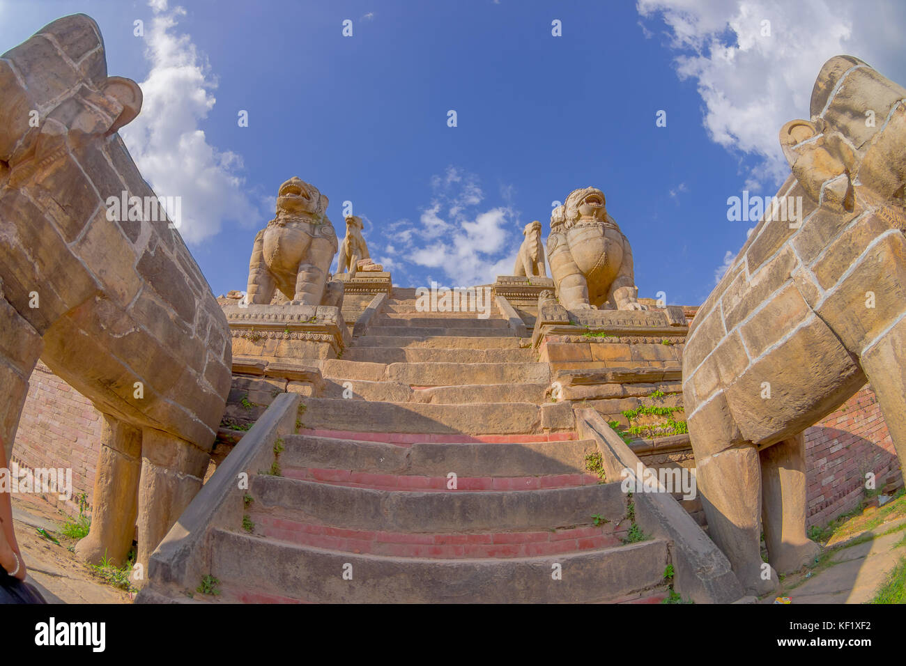 BHAKTAPUR, NEPAL - NOVEMBER 04, 2017: Stone guardians on the stairs of the Nyatapola temple on Taumadhi Tole, BHAKTAPUR, NEPAL Stock Photo