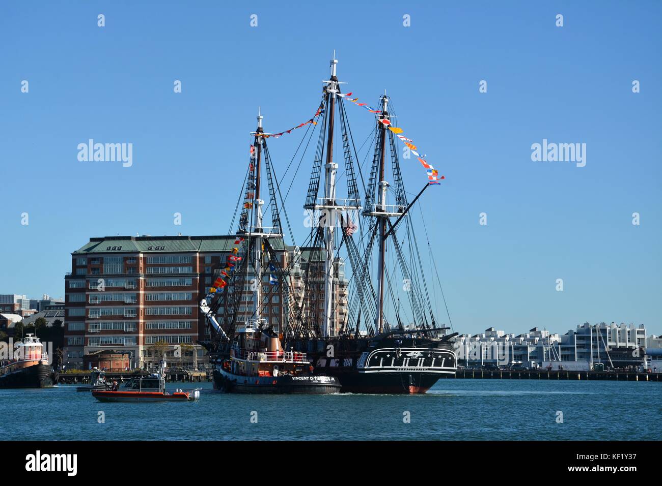The historic USS Constitution sailing in Boston Harbor after a series