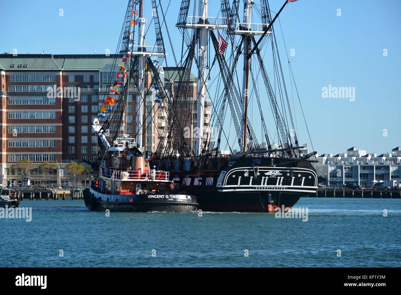 The historic USS Constitution sailing in Boston Harbor after a series
