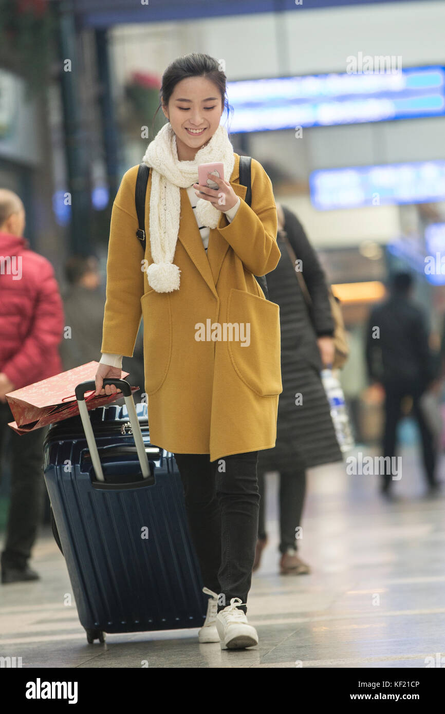 Young women at the railway station Stock Photo - Alamy