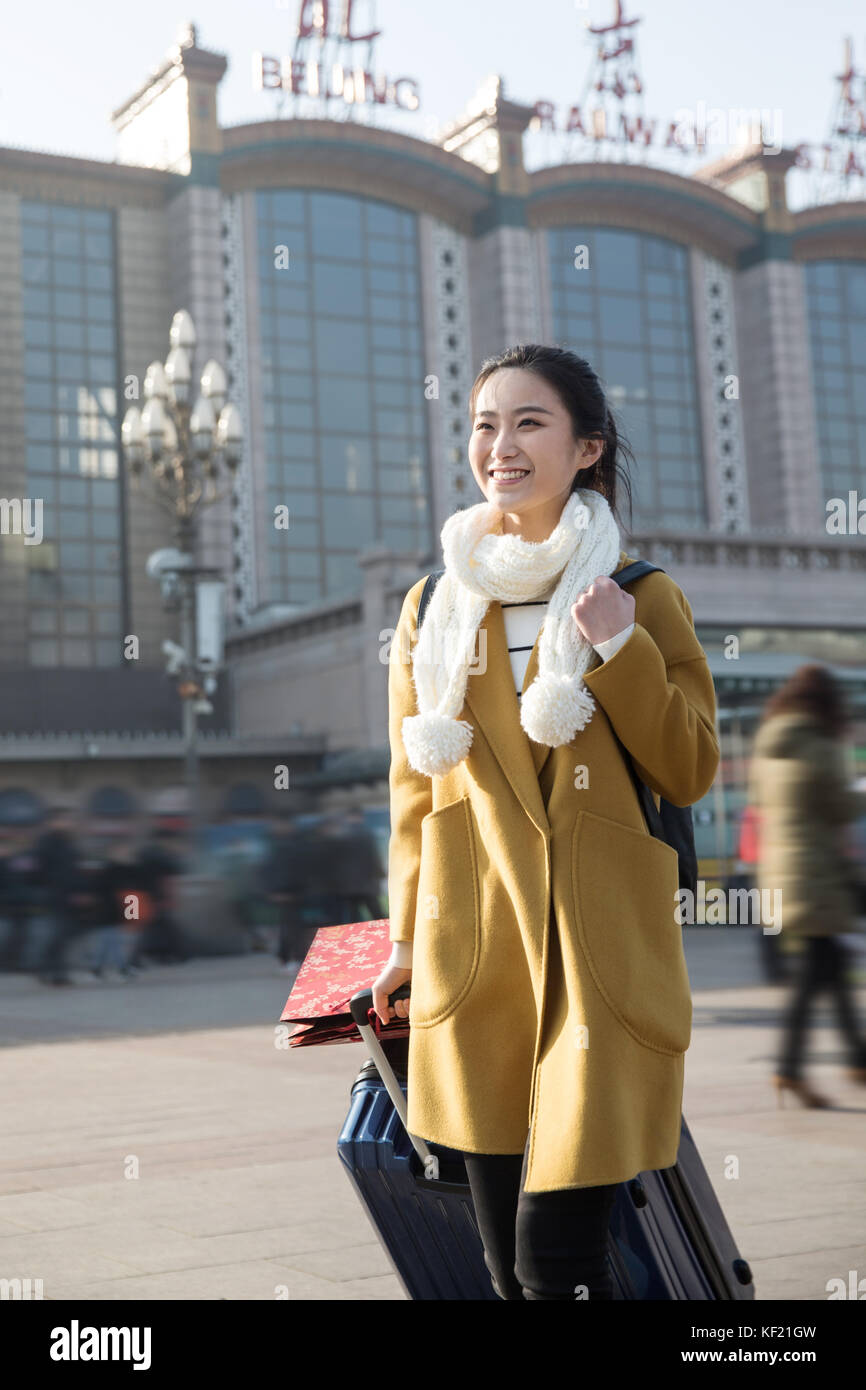 Young women at the railway station Stock Photo - Alamy