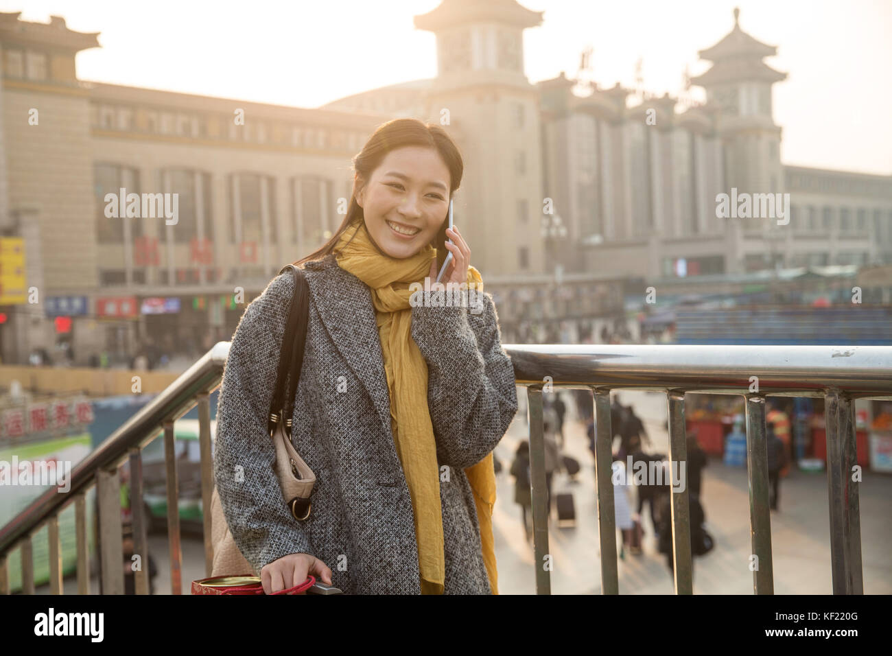 Young women at the railway station Stock Photo - Alamy