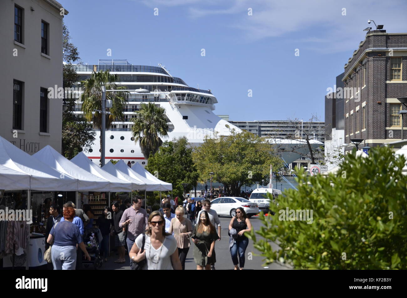 A street market in Argyle Street, Sydney with cruise liner Carnival Spirit in the background moored at Cicular Quay. Stock Photo