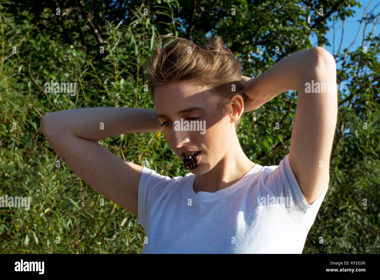 Young Woman Pinning Up Her Hair Stock Photo 164169690 Alamy