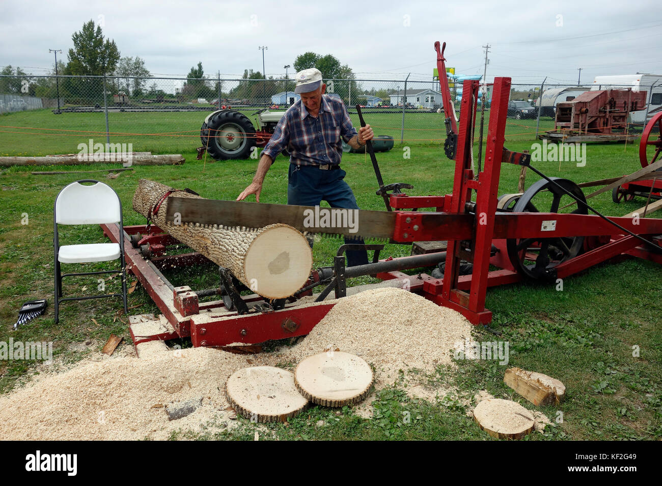 An antique drag saw and acadia engine used for sawing logs Stock Photo