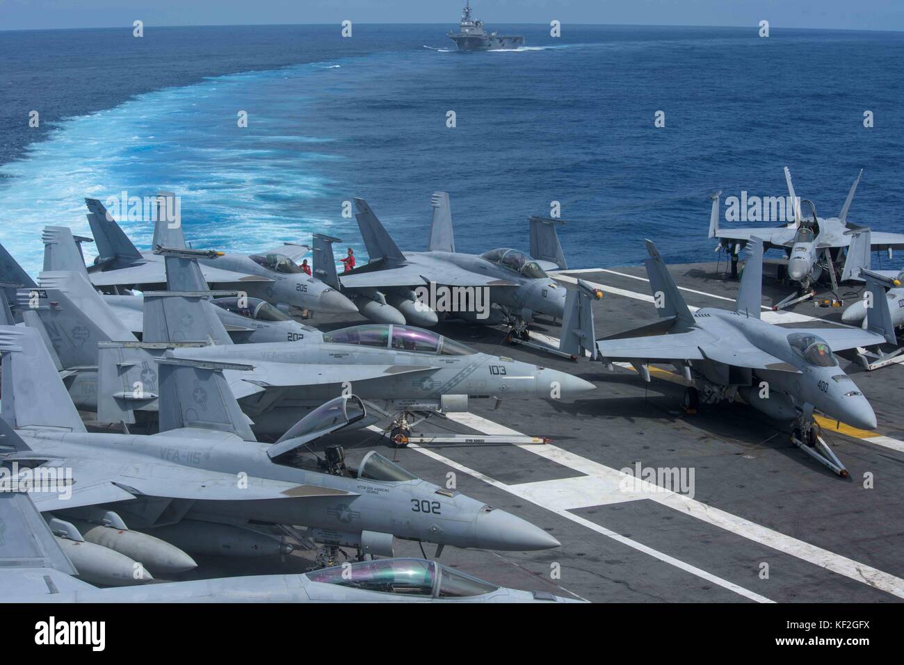 Aircraft line up on the flight deck of the U.S. Navy Nimitz-class aircraft carrier USS Ronald Reagan as it steams underway September 13, 2017 in the Philippine Sea. Stock Photo