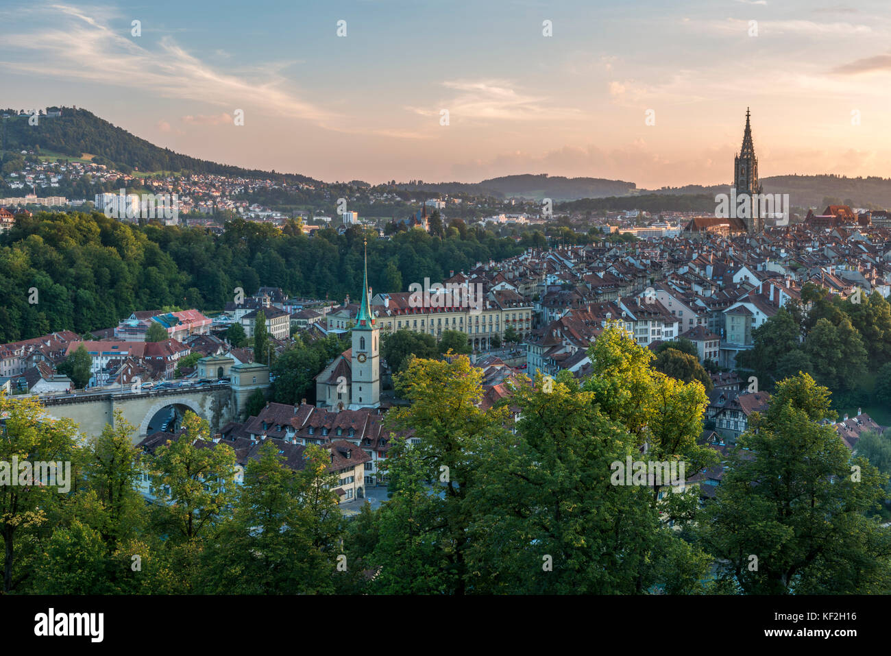 Switzerland, Bern, cityscape with Nydeggkirche and minster in the evening Stock Photo