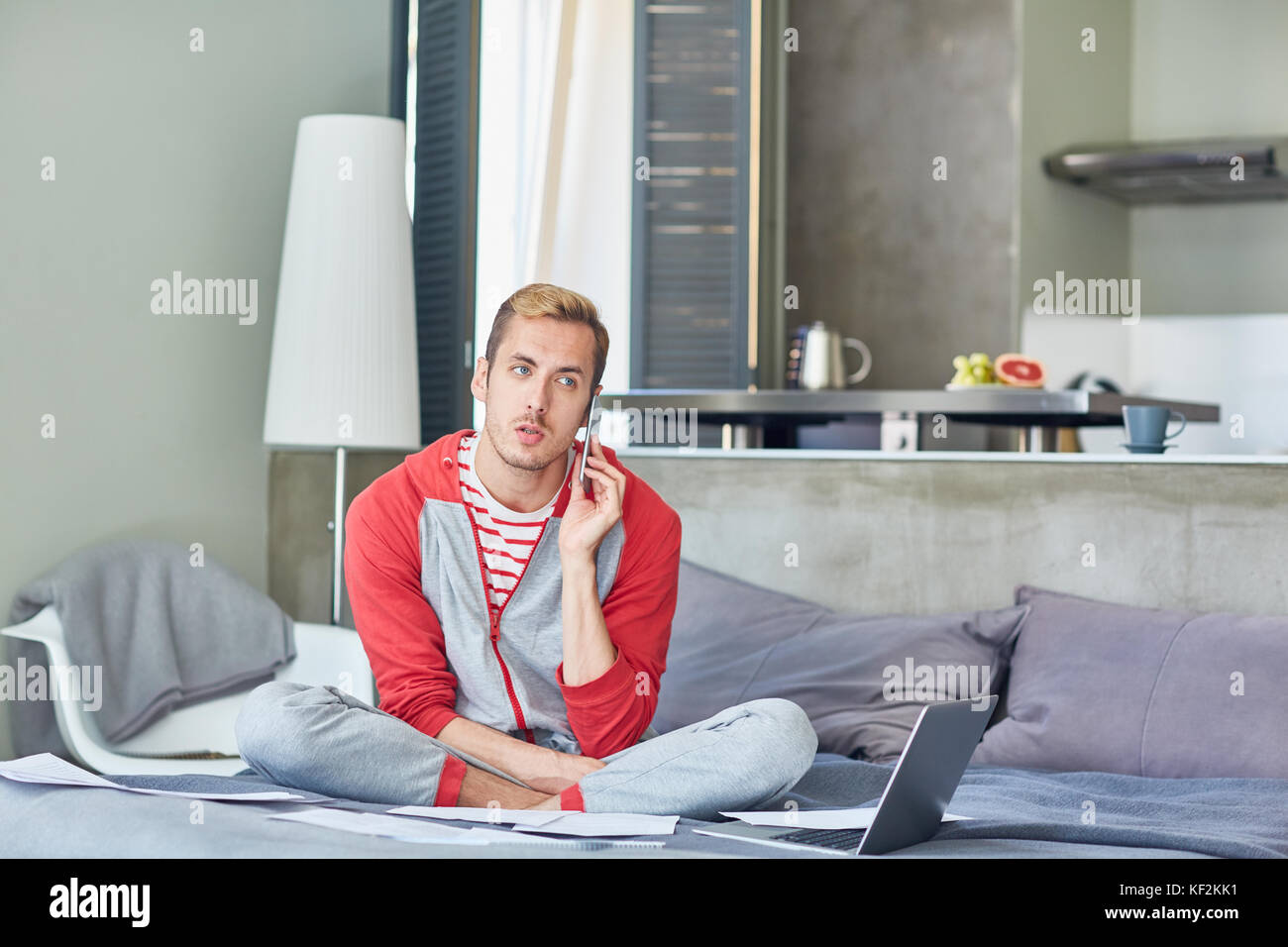 Calling on bed Stock Photo Alamy