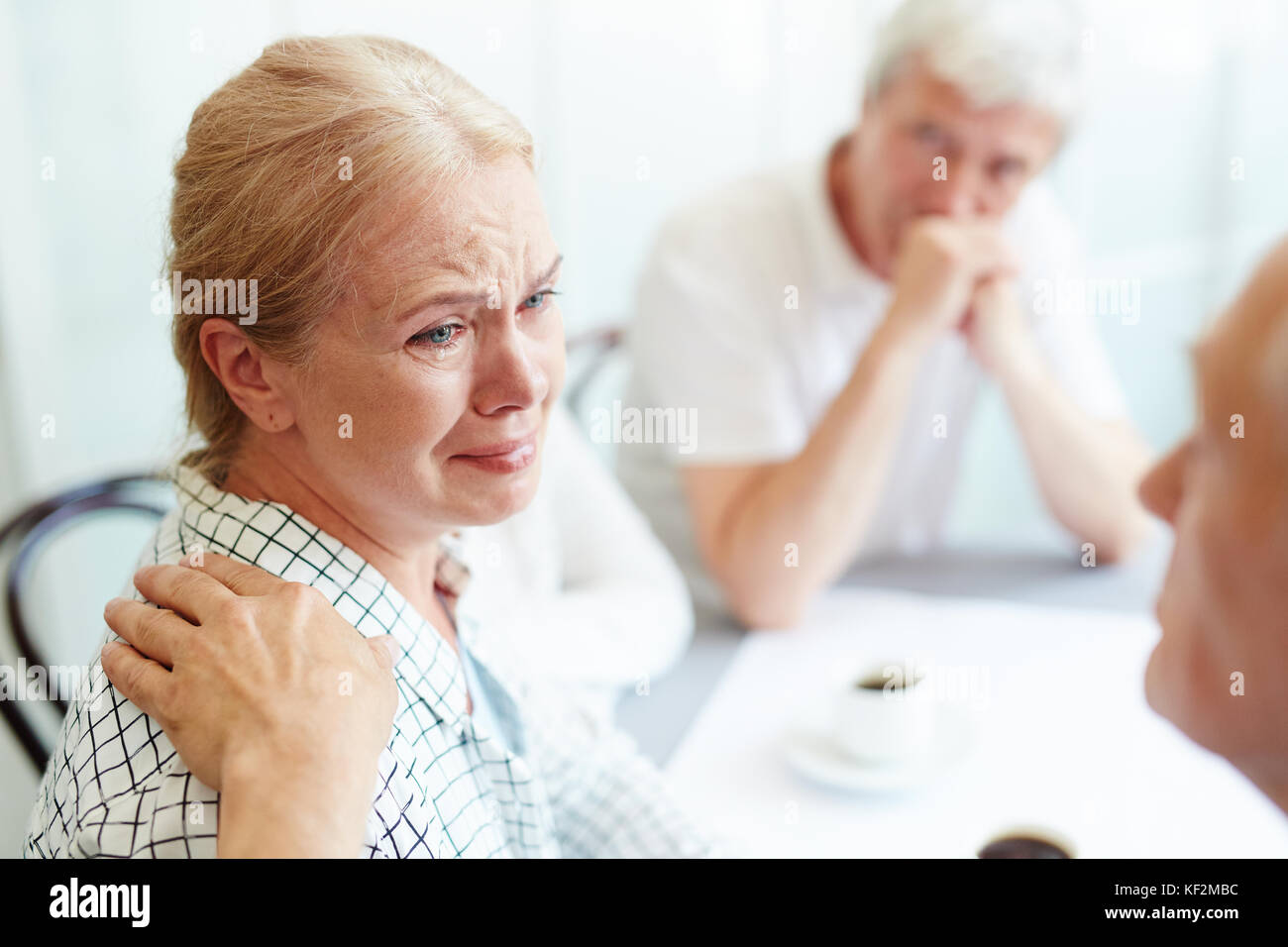 Taking care of crying friend Stock Photo