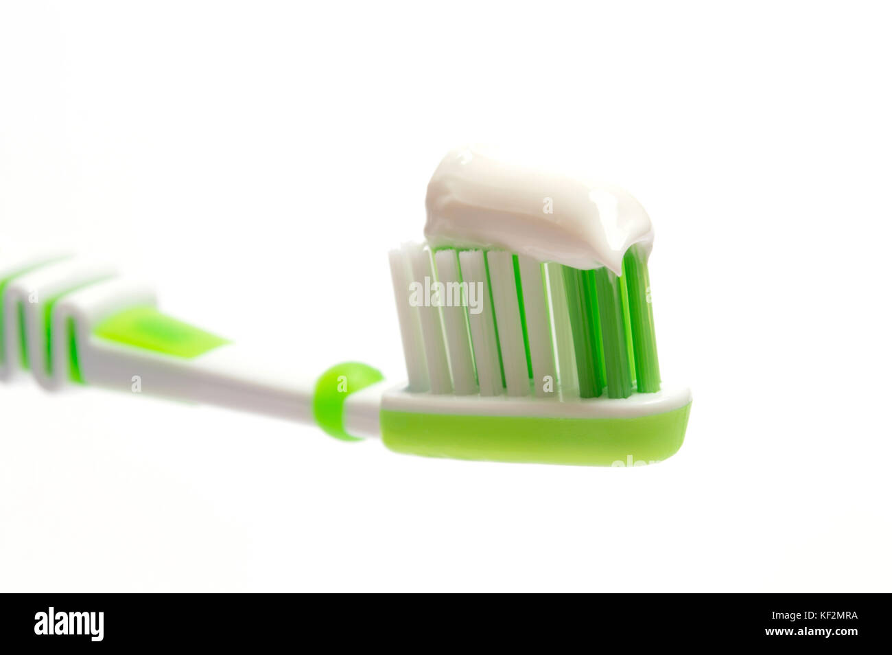Green Toothbrush on a white background Stock Photo - Alamy