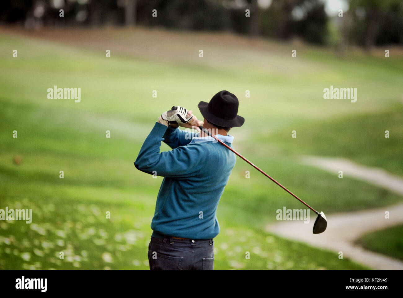 golfer shooting a golf ball Stock Photo Alamy