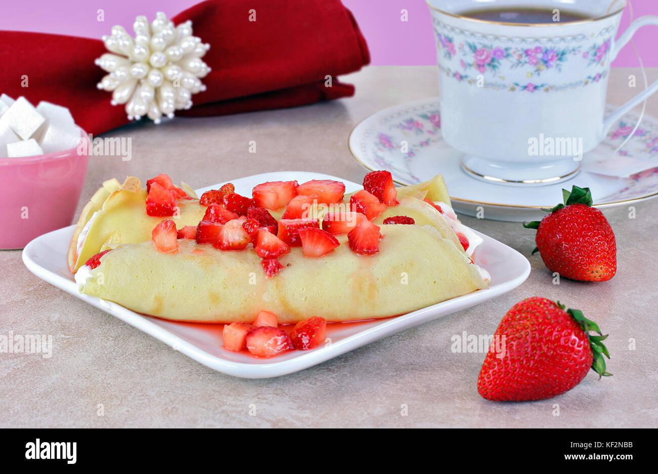Delicate strawberry crepes set in a feminine table setting Stock ... Delicate strawberry crepes set in a feminine table setting Stock ...