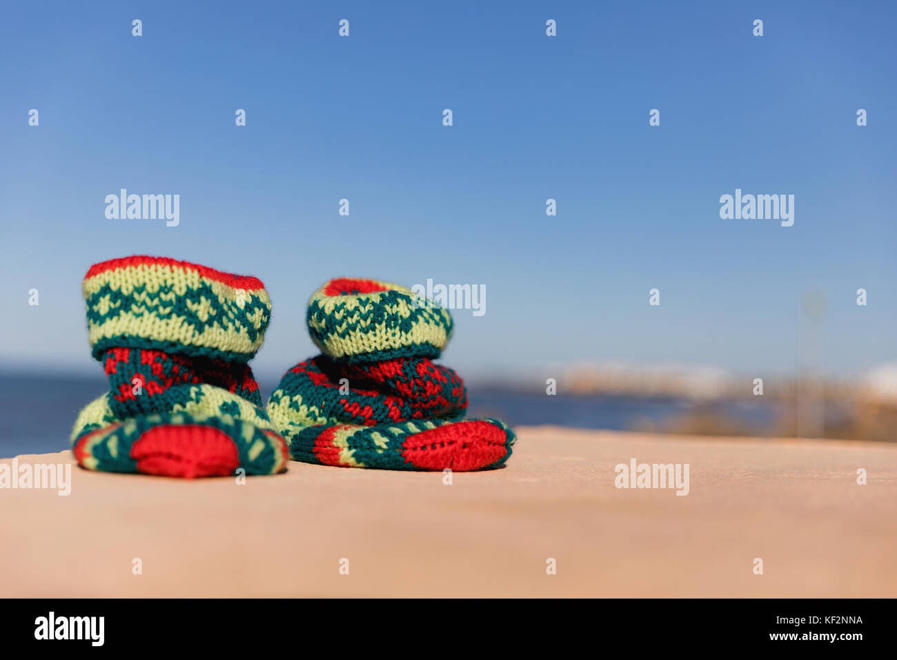 Christmas sock at exotic tropical beach. Holiday concept for New Years Cards. Christmas socks. hand-knit Christmas sock Stock Photo