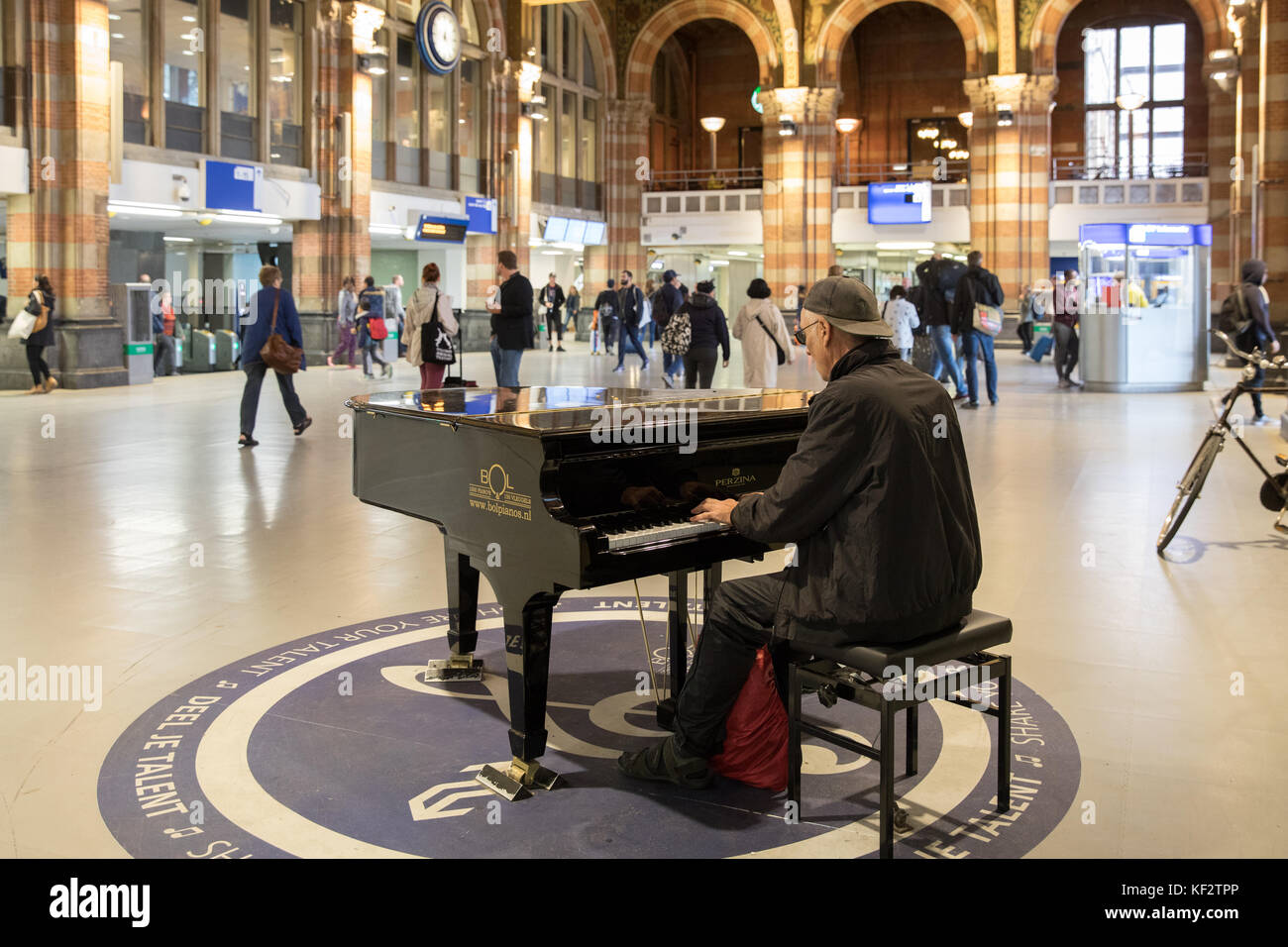 The public piano in Central station, Amsterdam, Netherlands Stock Photo