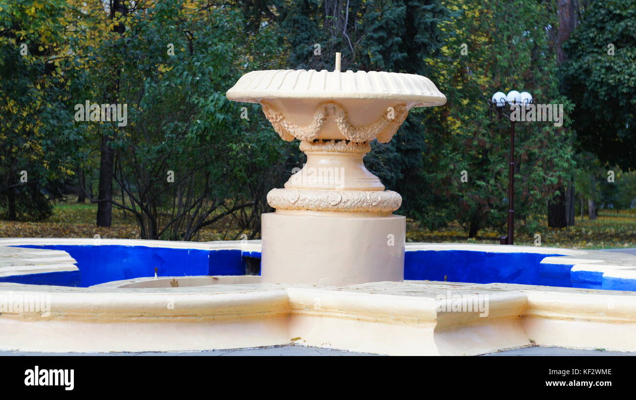 Old dry fountain in the park of Nalchik in the fall. Stock Photo