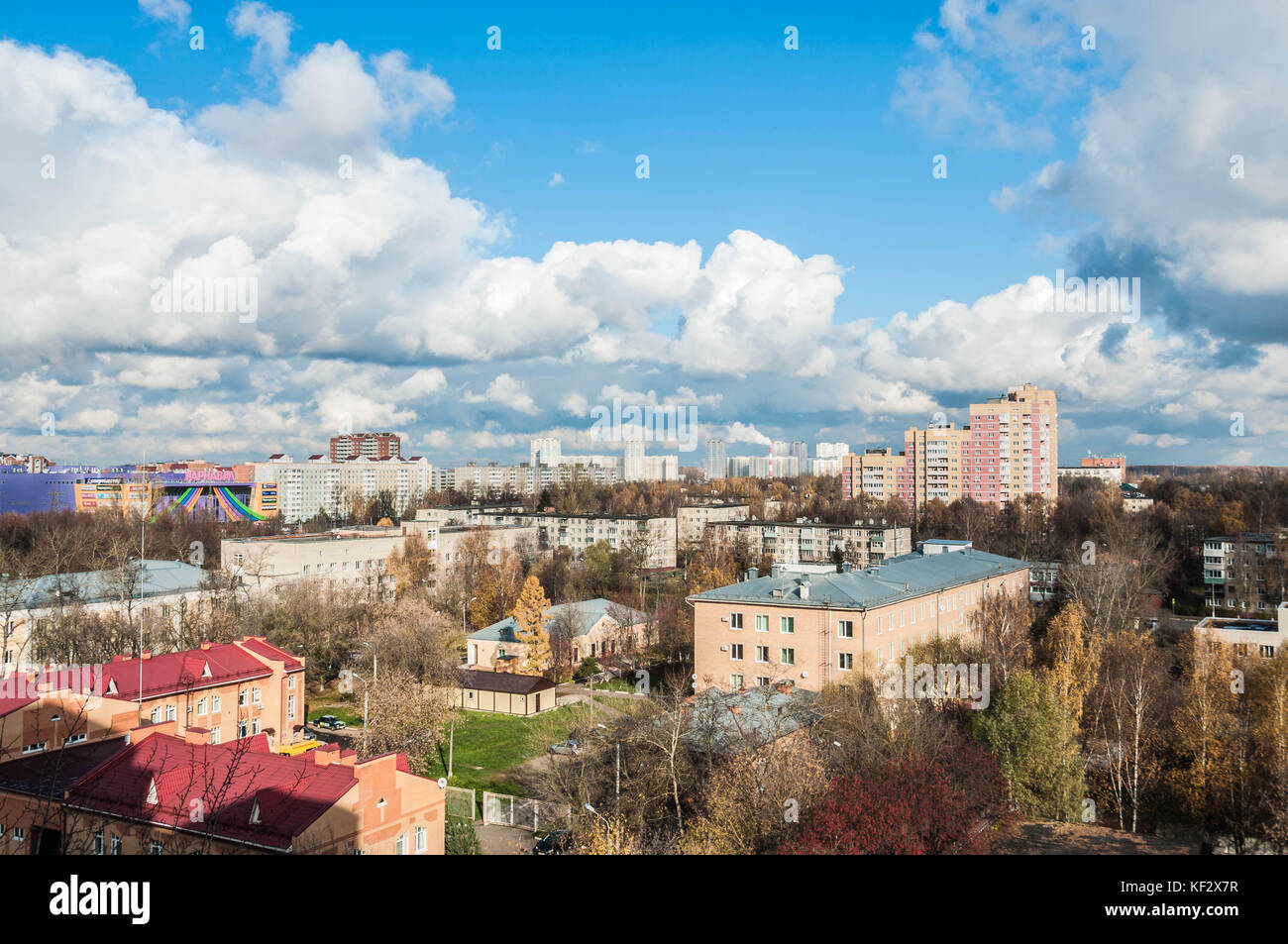 A new town under a huge sky with white clouds Stock Photo