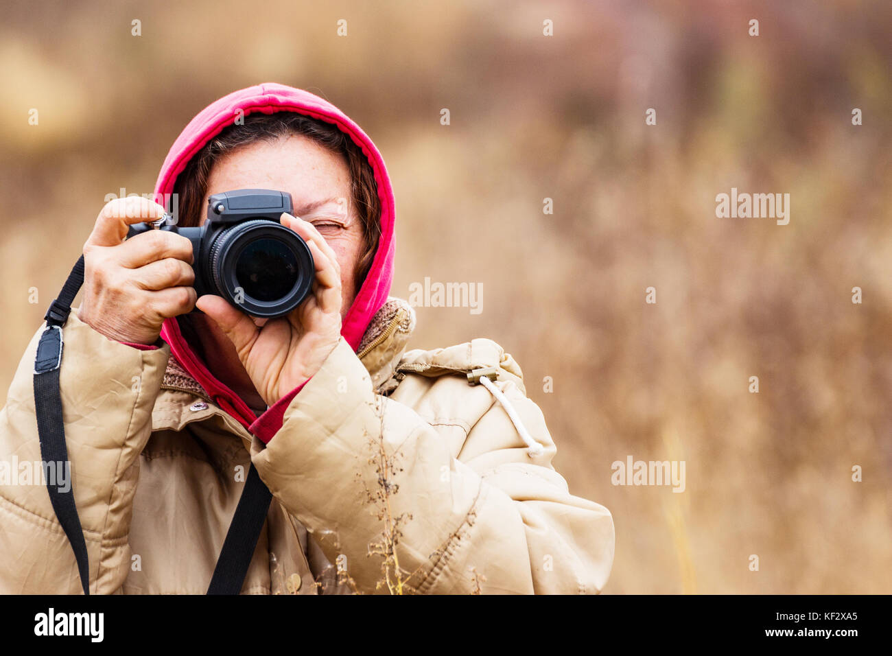 Female looking through the viewfinder Stock Photo Alamy
