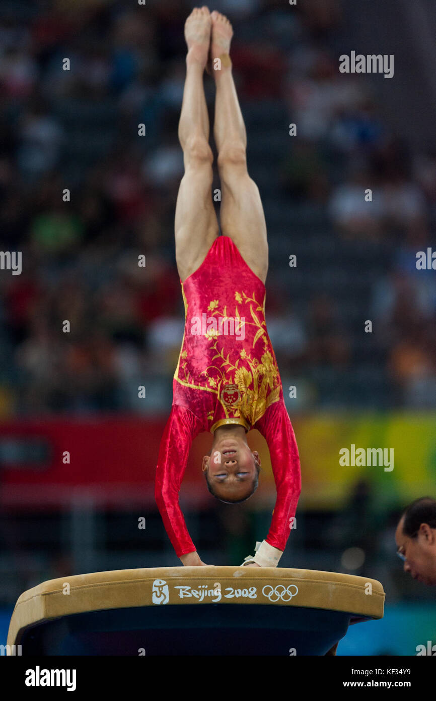 Chinese woman gymnast competing on the vault in the Women Team Event at