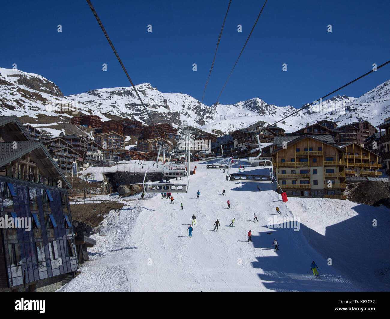 Val Thorens, France   March  18, 2017: Ski slope and chairlift in Val Thorens, people skiing in the middle of the village Stock Photo