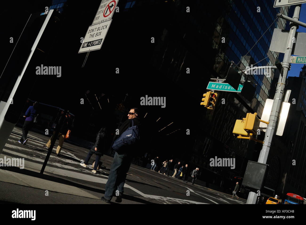 Man at crossroads in Manhattan Stock Photo