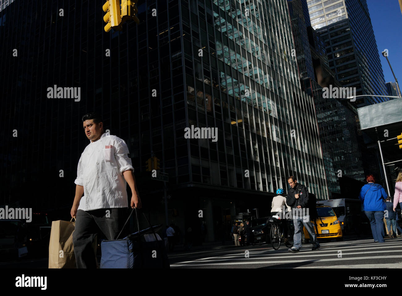 Chef crossing street in New York City Stock Photo