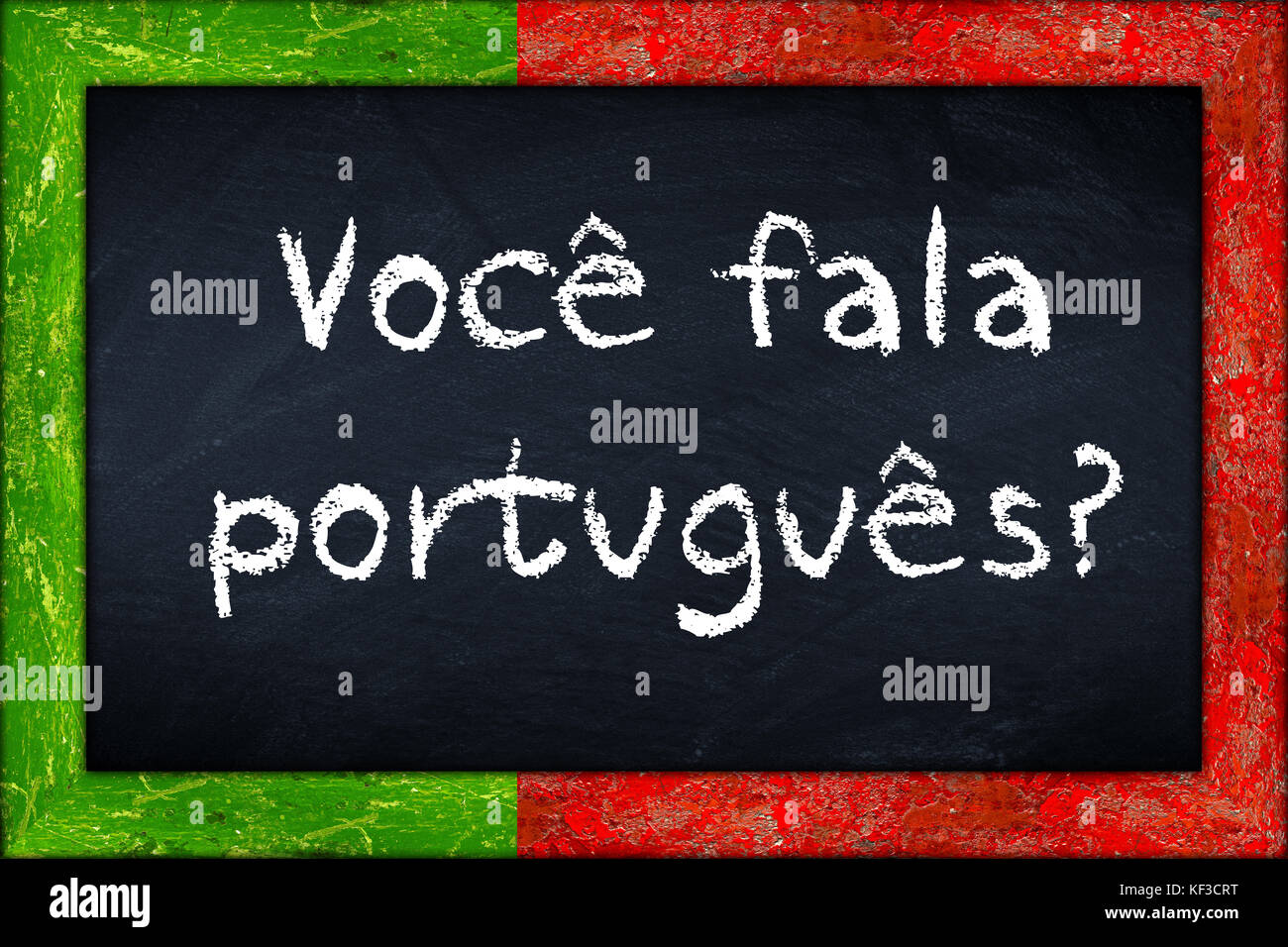 Voce fala portugues (translation: do you speak portuguese) language education concept on chalkboard blackboard with wooden portugal flag frame Stock Photo
