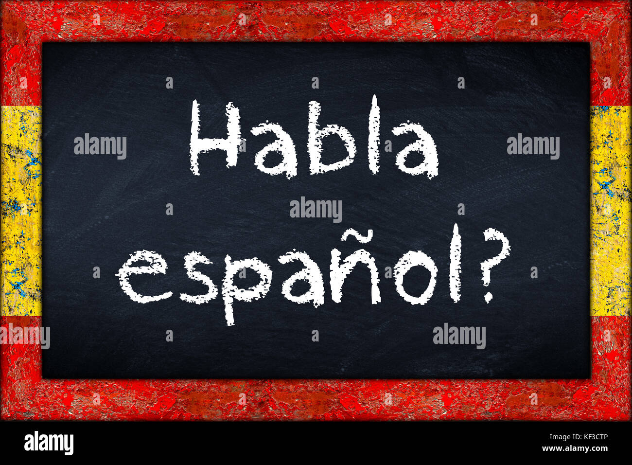 Habla espanol (translation: do you speak spanish) language education concept on chalkboard blackboard with wooden spain flag frame Stock Photo
