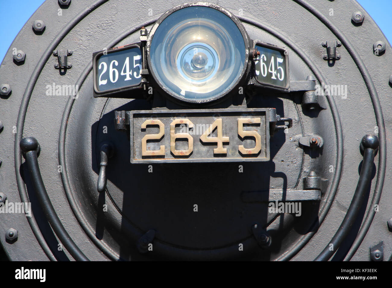Old train locomotive up close shot of front Stock Photo