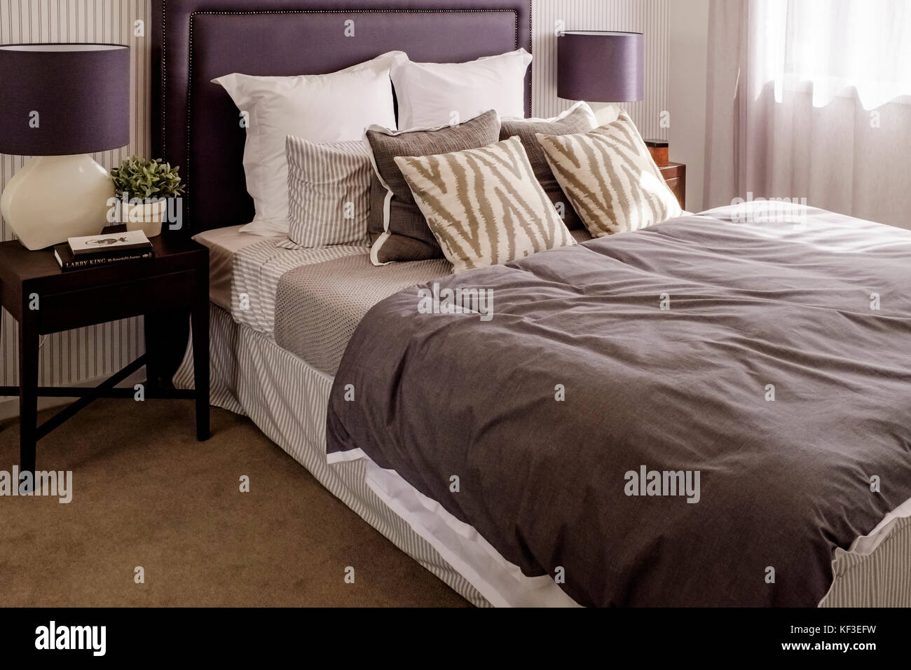 The bedroom of a modern Australian home featuring the latest on-trend decorations and accessories. Stock Photo