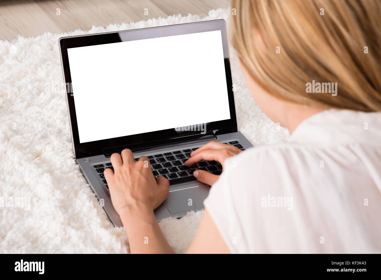 Close-up Of Woman Using Laptop Showing Blank Screen At Home Stock Photo ...