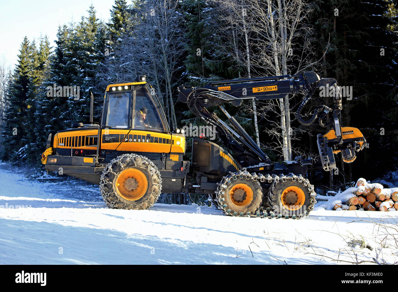 SALO, FINLAND -  FEBRUARY 27, 2016: Unnamed driver is about to begin harvesting with PONSSE Ergo forest harvester on a winter morning in South of Finl Stock Photo