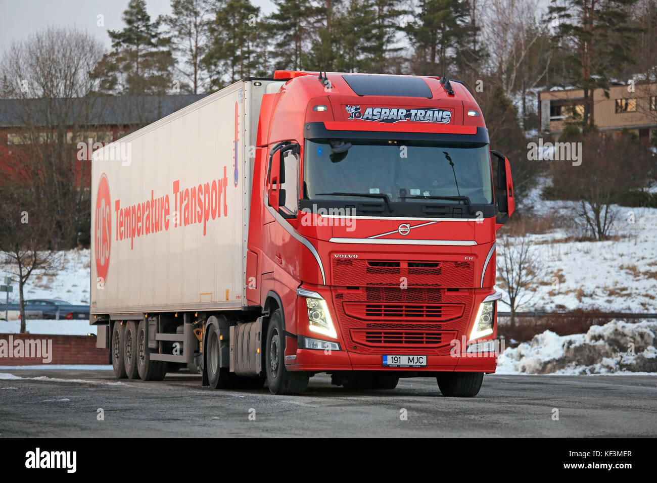 SALO, FINLAND - FEBRUARY 27, 2016: Red Volvo FH semi for temperature controlled transport ready to go at a truck stop in South of Finland. Refrigerate Stock Photo