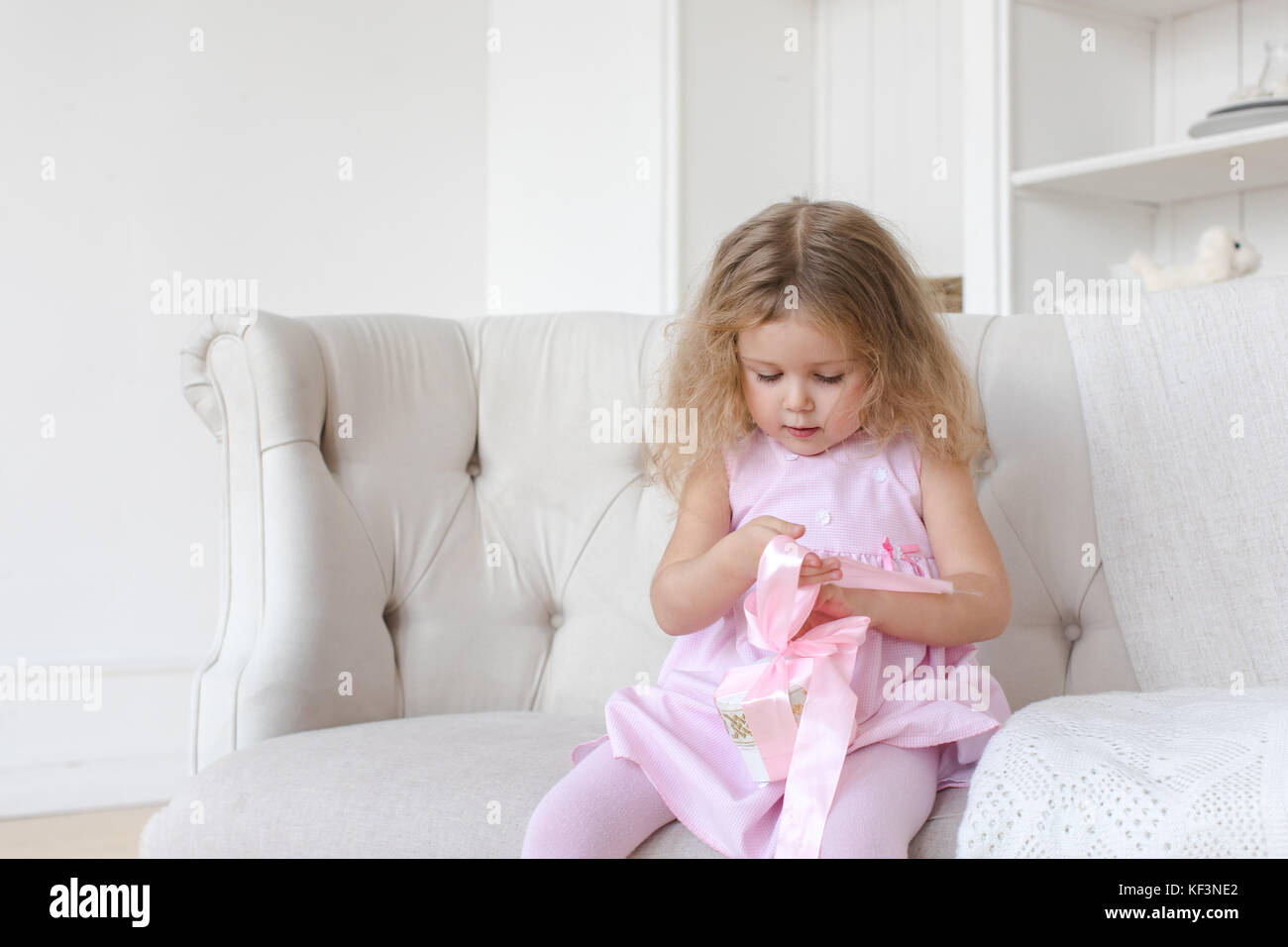 Cute girl with ribbon gift Stock Photo