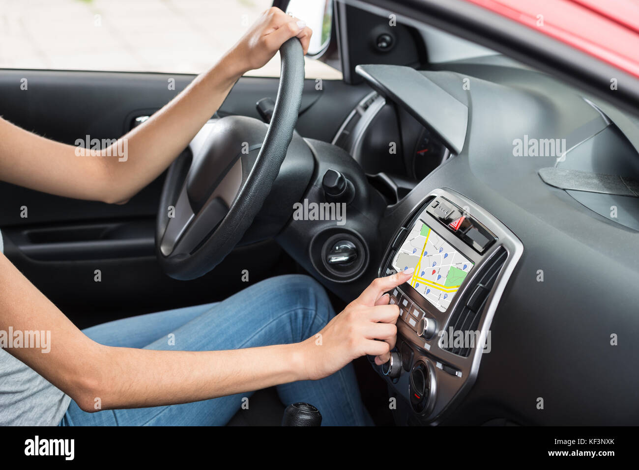 Woman Sitting Inside Car Using GPS Navigation Stock Photo