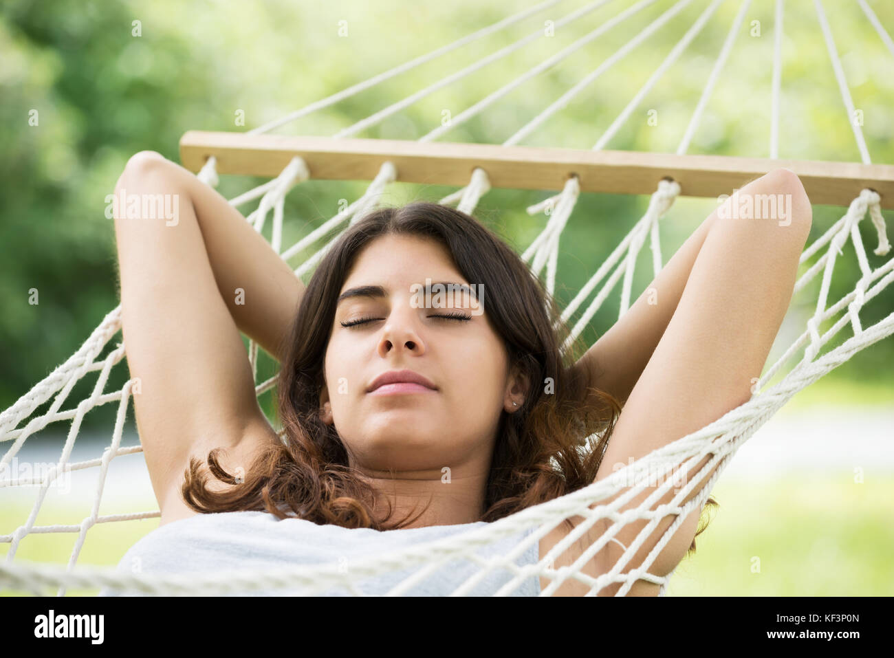 Close-up Of Young Woman Lying In Hammock Stock Photo - Alamy