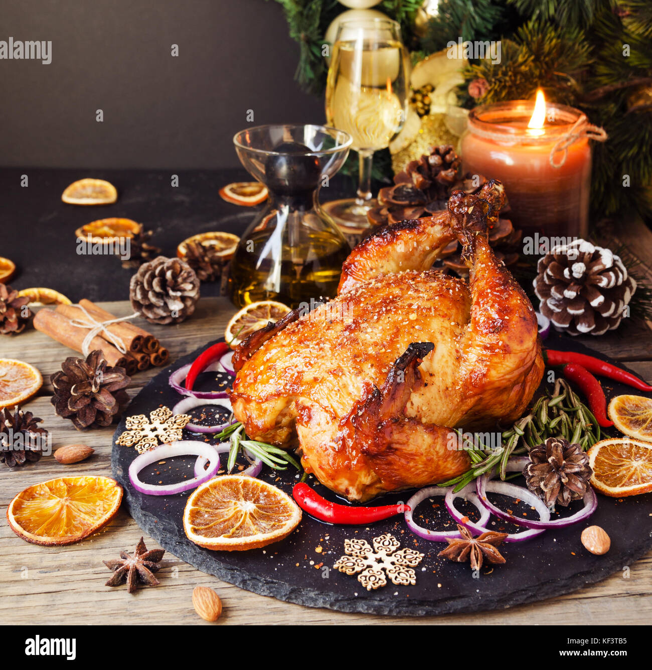 Roast chicken or turkey for Christmas and New Year with mulled wine and Christmas decorations, space for text, selective focus Stock Photo